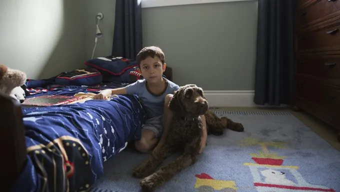 kid in bedroom with dog