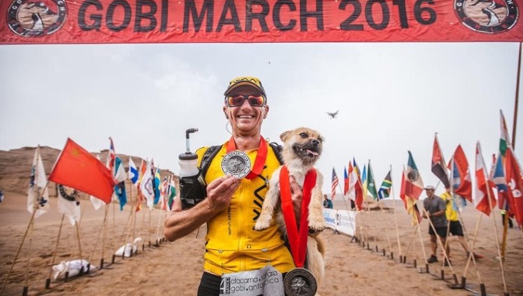 Gobi and Leonard at the finish line with medals