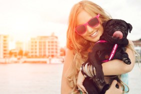 Cute puppy dog and female owner.