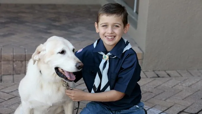 cub scout boy with dog