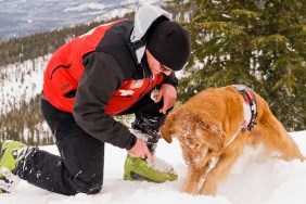 Ski Patroller working with dog