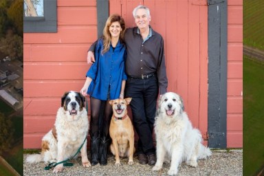 founders of jameson animal rescue ranch with their dogs