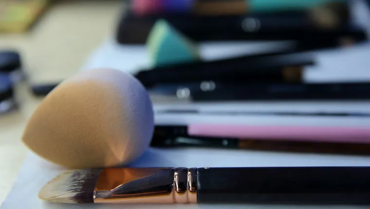 make up brushes and beauty blender on table
