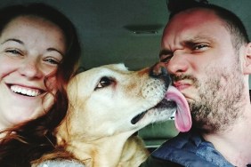Portrait Of Man And Woman With Dog In Car