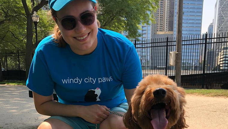 dog walker poses with pooch