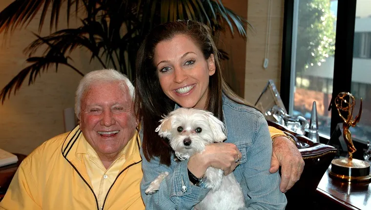 BEVERLY HILLS- JANUARY 12, 2005: Game show producer Merv Griffin poses with pet expert Wendy Diamond and her dog Lucky Diamond at his home in Beverly Hills, California on January 12, 2005. Griffin passed away August 12, 2007 at the age of 82 after a long battle with prostate cancer. 