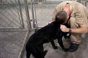UNITED STATES - JUNE 30: Bay Correctional Facility inmate Douglas Whitney locks up his dog Cletus after the afternoon training session. This is his fourth dog he's trained in as many years. "It's taught me to respect life," he said. "I'm more patient and caring now than when I came in here."