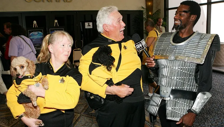 LAS VEGAS - AUGUST 17: Pat Krob (L) and her husband Ken Krob of California hold their poodles named "Lt. Tasha Yar" (L) and "Mr. Data" as they are interviewed by G4TV correspondent William O'Neal of California at the fifth annual official Star Trek convention at the Las Vegas Hilton August 17, 2006 in Las Vegas, Nevada. 