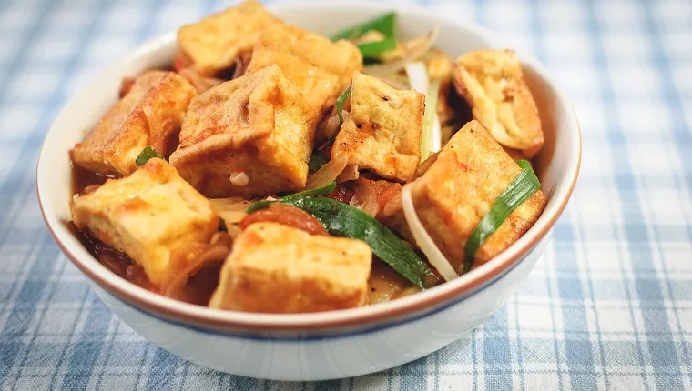 Close-Up Of Tofu With Sauce In Plate