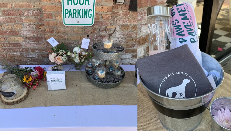 Fundraising items for purchase, including 25 percent from The Local Petaler and 100 percent from Swanky Cakes, right outside Kimmer's Ice Cream, who donated the event space and raffle items. Raffle pail on the right.