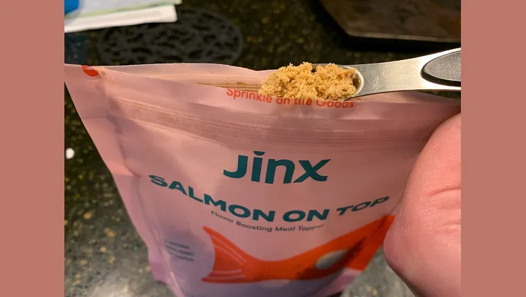 a scoop of jinx salmon meal topper