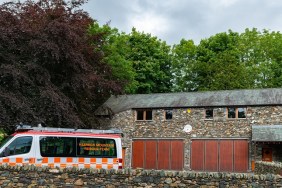 Keswick, England, UK - August 7, 2012: A building and vehicle used by members of Keswick Mountain Rescue Team. Keswick in the English Lake District is a popular tourist destination for hill walkers from the UK and overseas.