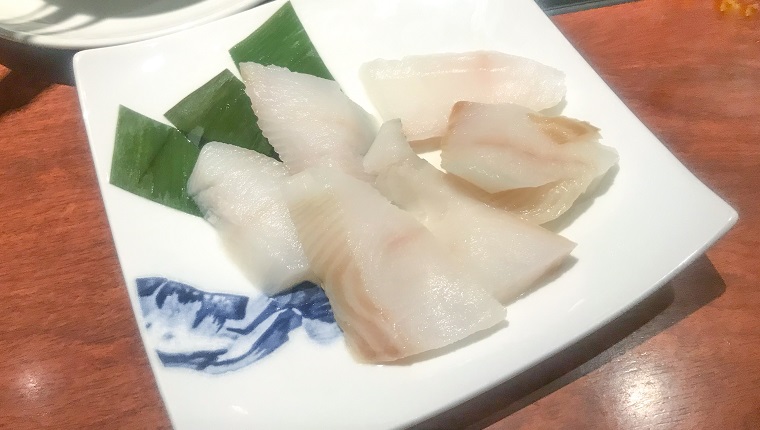 Flounder fillets served in square plate as ingredients of suancaiyu hotpot