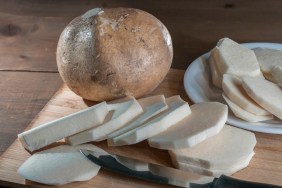 slices of jicama, yam bean, mexican yam bean, tubers or Pachyrhizus erosus on a cutting board