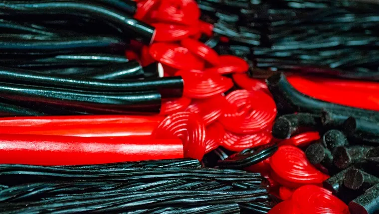 Lots of licorice sticks and spirals in black and red. Sweet background