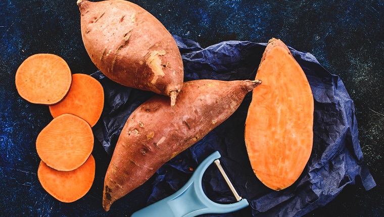 Sliced and whole sweet potatoes
