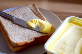spreading margarine butter onto bread