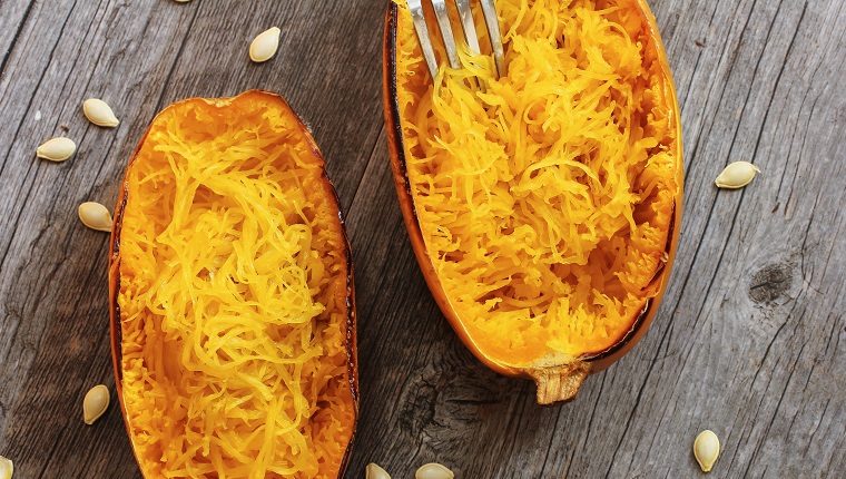 Spaghetti squash with bacon and spring onion topping top down view