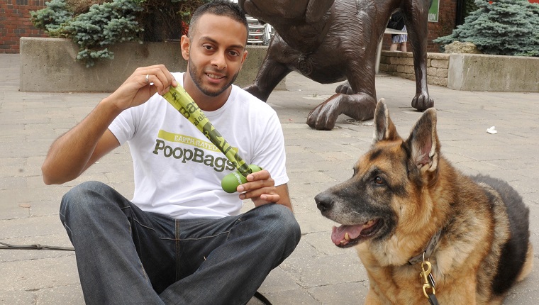 24 june 2012. Earth Rated Poop Bags GÇô they make biodegradable and compostable bags to pick up poop. Marketing director Divyan Selvadurai and his dog Pepe at a pet store that carries the company's poop bags. Photo by Keith Beaty. 