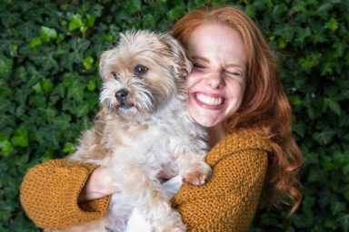 woman hugs dog why the Wall Street Journal is wrong about dogs