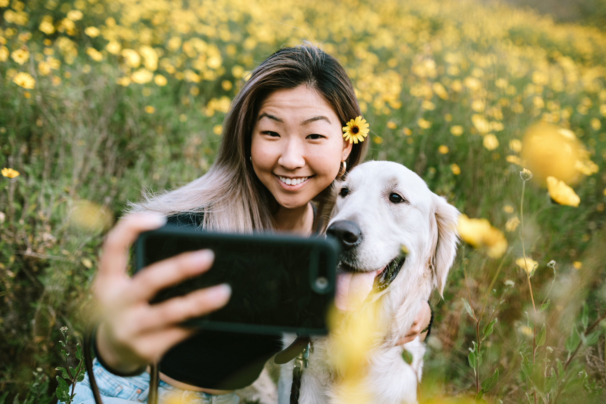 young woman taking selfie with dog most dog-friendly instagram spots