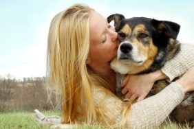 woman hugging dog best prayers for sick dogs