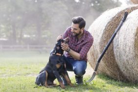 farmer with best dog breeds for homestead