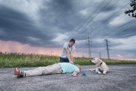 man performing CPR dog saves man's life