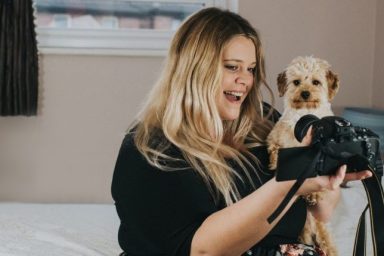 woman taking selfie with dog social media presence