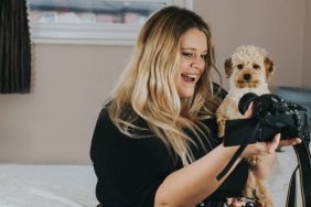 woman taking selfie with dog social media presence