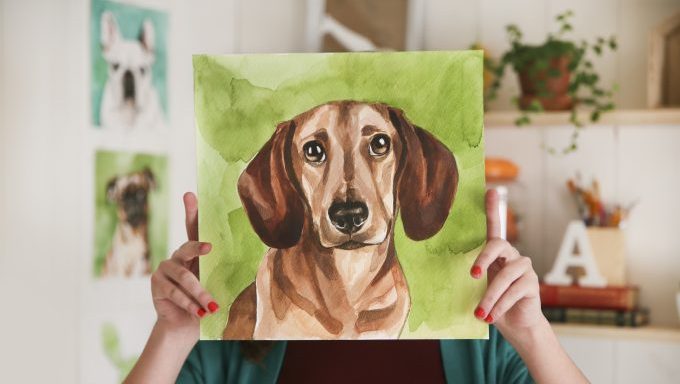 woman holding up custom dog portrait