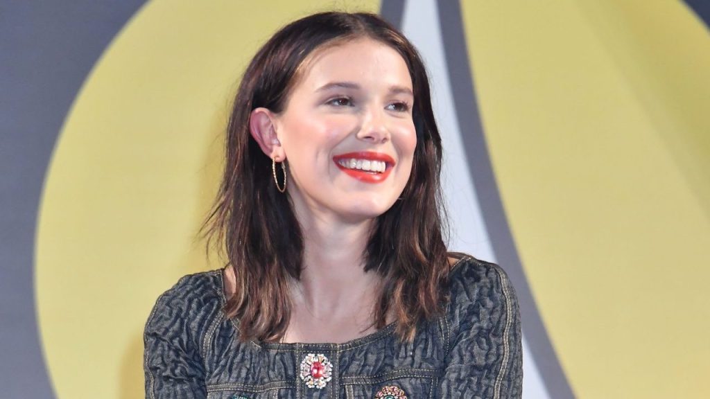 Millie Bobby Brown, a proud dog mom, smiling.
