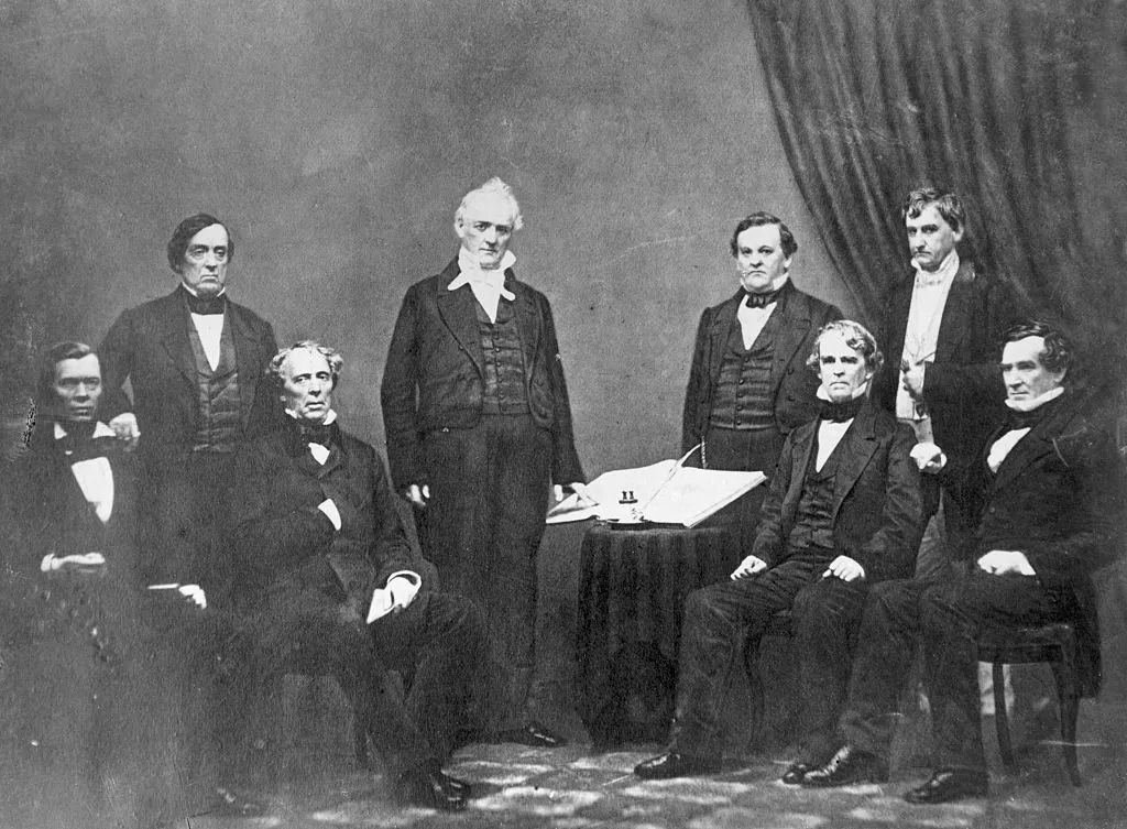 (Original Caption) Cabinet of President J. Buchanan (center) Standing at left to right: Lewis Cass (Sect. of State), Buchanan, Howell Cobb (Sect. of Treasury) Hos Holt (Postmaster General). Seated Left to Right: Jaocb Thimpson (Sect. of Interior), John B. Floyd (Sect. of War), Isaac Toucy (Sect. of Navy) Jeremiah Balck (Attorney General). Picture probably taken in 1859 when Holt became a Member of Cabinet.