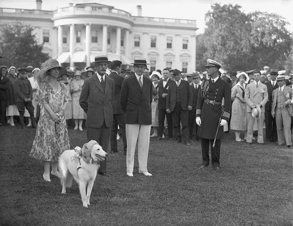 President and Mrs. Calvin Coolidge with Andrew Mellon and others on the White House lawn.