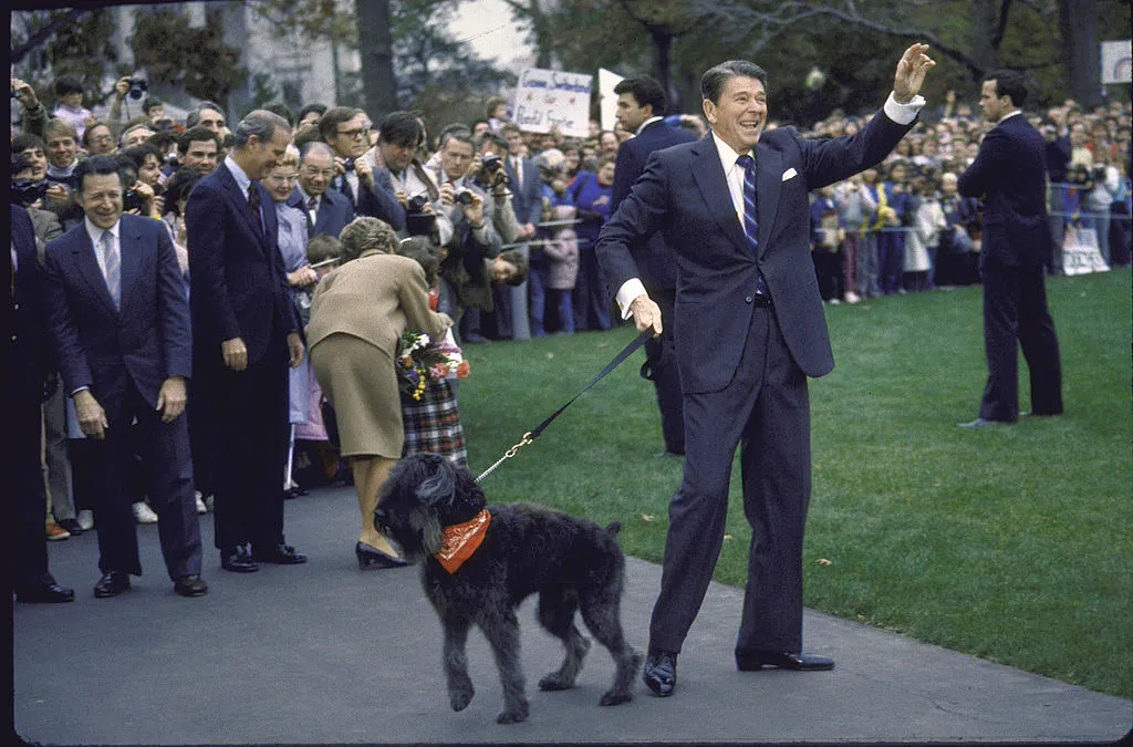 President Ronald Reagan with dog Lucky and wife Nancy (in back), ready to go to Geneva.