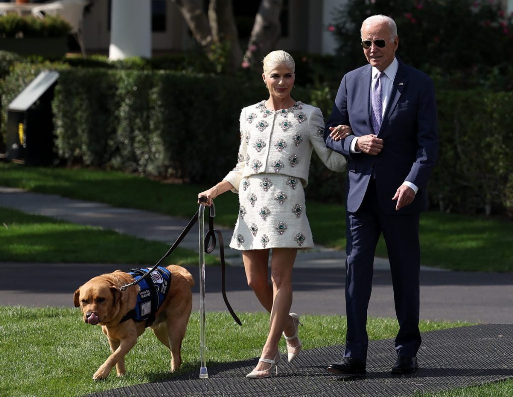 Selma Blair walking with her service dog next to President Joe Biden at White House