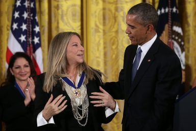 WASHINGTON, DC - NOVEMBER 2015: U.S. President Barack Obama (R) presents the Presidential Medal of Freedom to singer Barbra Streisand (L) during an East Room ceremony at the White House in Washington, D.C. when Streisand brought her dog with her. (Photo by Alex Wong/Getty Images)