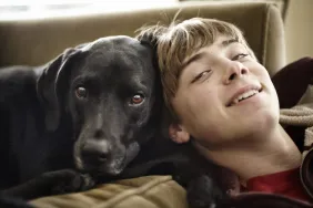 Black labrador service dog with teen in Maine, like the service dog for the autistic teen.