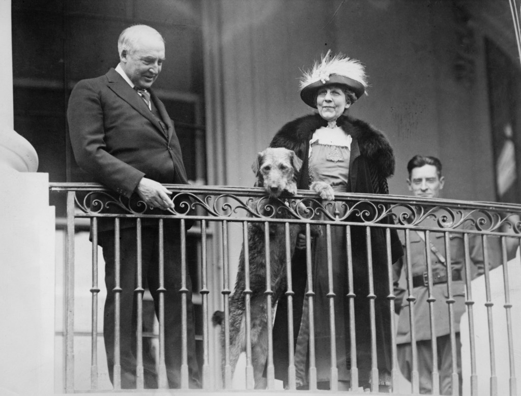 Former US President Warren G. Harding with his wife, Florence Harding, and their Airedale Terrier, Laddie Boy.