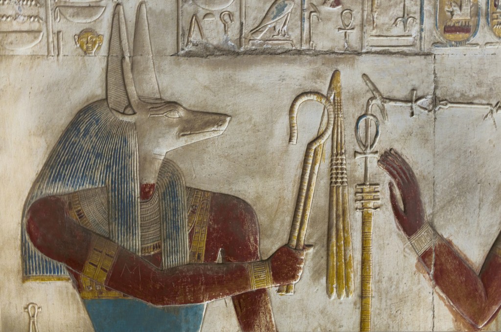 Bas-relief of the God Anubis, a mythological diety, in the Temple of Seti I at Abydos . Egypt .