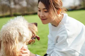 Young woman living with emotional support dog. Having an ESA dog with a verified ESA letter can improve mental health and wellbeing.
