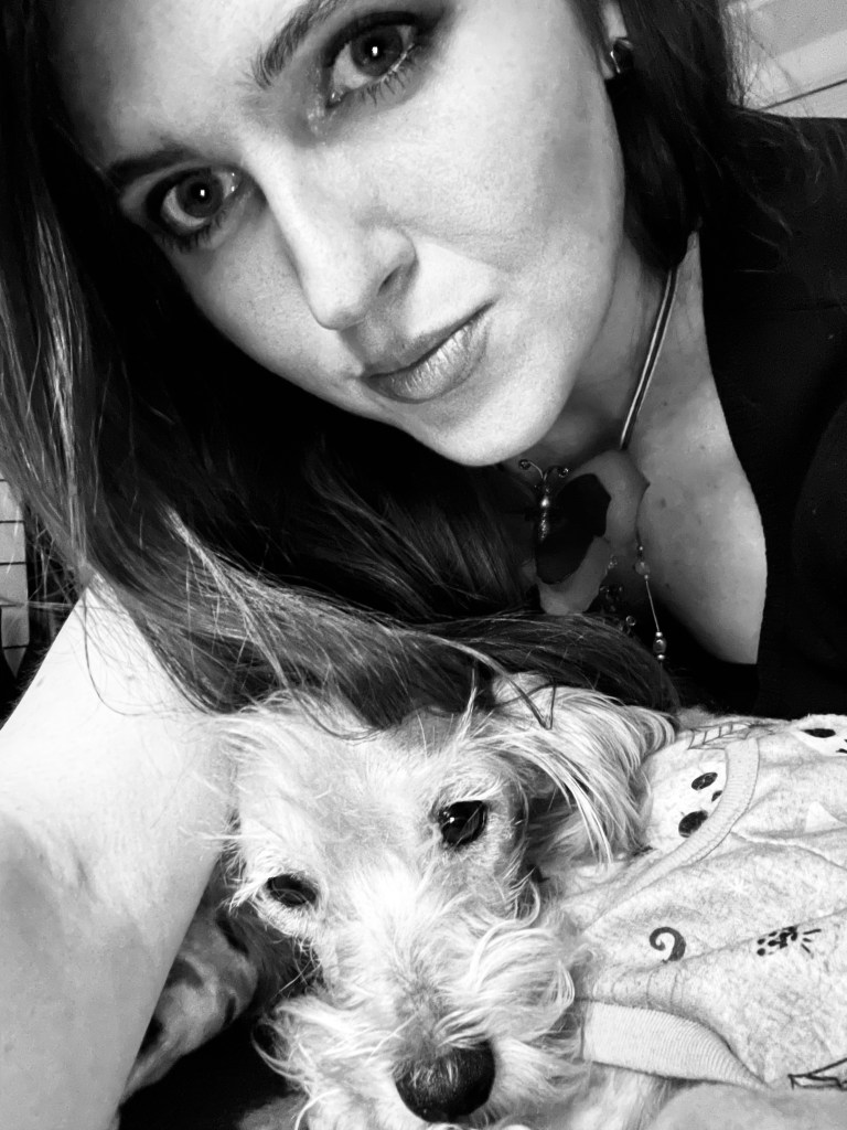 Close-up of Jenna holding her newly rescued senior dog Goldie.