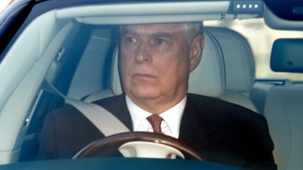 Prince Andrew in his car, he recently almost hit a dog until alerted by his bodyguard.