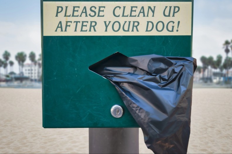 Dog Waste Station with disposable plastic bags, Venice Beach, California, USA