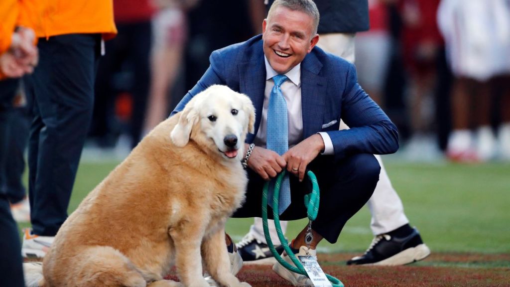 Football analyst, Kirk Herbstreit, with his dog, Ben, who recently passed away due to cancer, before the college football game between the Tennessee Volunteers and Arkansas Razorbacks on October 5, 2024, at Donald W. Reynolds Razorback Stadium in Fayetteville, Arkansas.