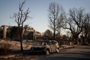 A destroyed home is seen as wildfires cause damage and loss through LA region.