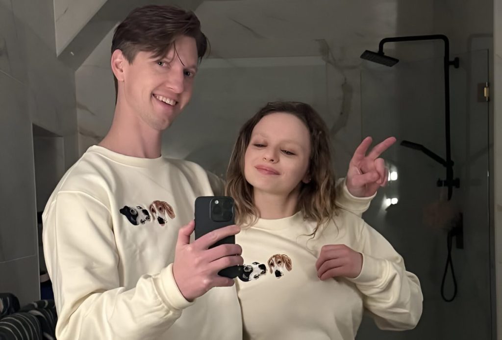 Joey King and her husband wearing tees with their dog’s faces.