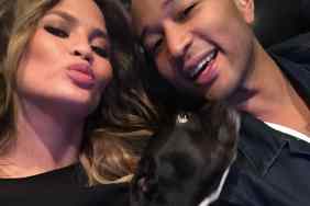 Chrissy Teigen and John Legend with their dog, Penny.