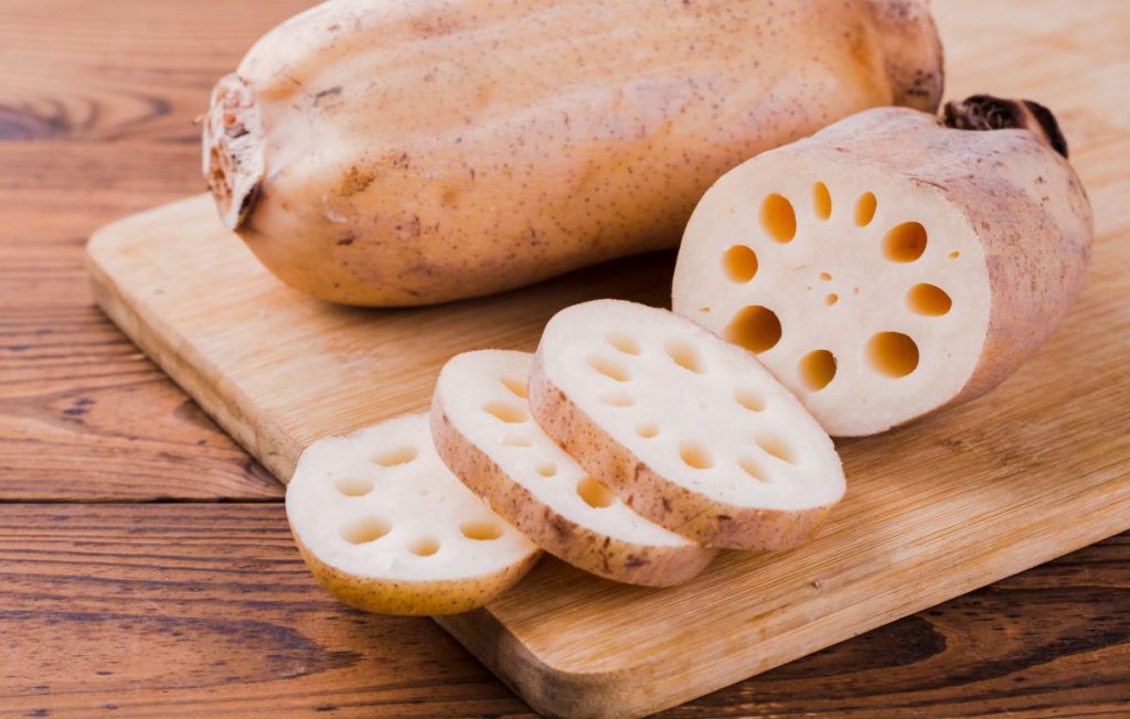 Lotus root chopped on a cutting board.