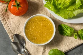 A closeup photograph of homemade Italian dressing, one of many salad dressings that dogs cannot eat safely.